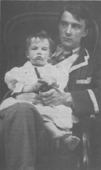 photograph of Robert Frost and a young child sitting on his knee