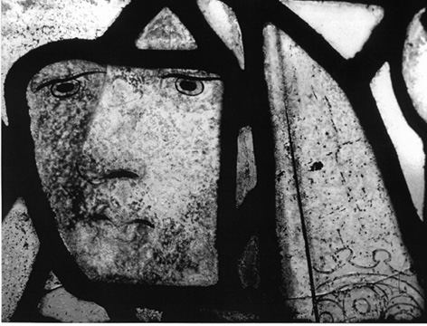 Image of a face in a stained glass window